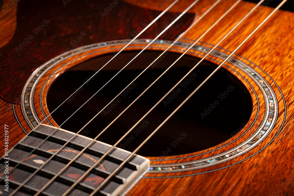 Obraz premium acoustic guitar sound hole on black background
