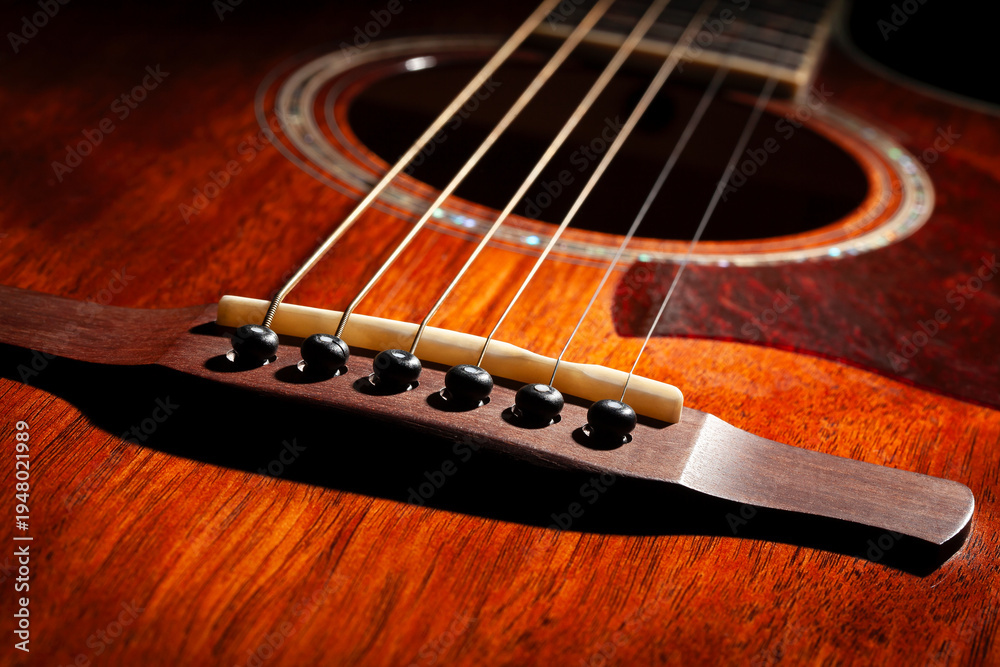 Obraz premium acoustic guitar bridge on black background