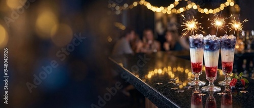 Colorful cocktails with sparklers on bar counter during celebration  