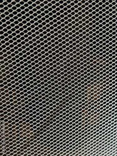 Wallpaper Mural Close-up of gray mesh fabric in sunlight, textured material with small perforated holes. Torontodigital.ca