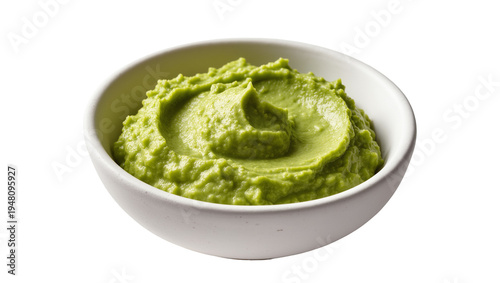 Tableau sur toile Isolated fresh creamy green avocado dip or guacamole in a white bowl, ready for serving