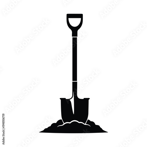 A shovel digging into a small mound of soil