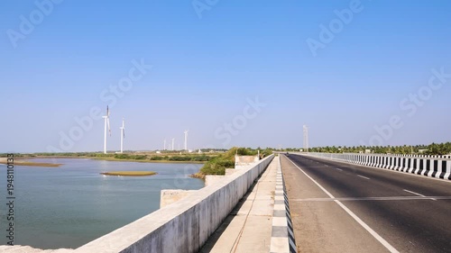 Wallpaper Mural coastal highway bridge with wind turbines and calm river landscape india Torontodigital.ca