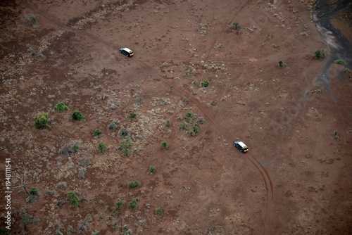 aerial view on a safari vehicle in the sparse savannah of the Amboseli National park in Kenya