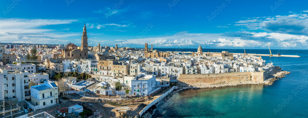 Fototapeta premium Aerial view of medieval castle and the historic center of Monopoli stunning blend of military fortification and Mediterranean coastal urbanism Puglia