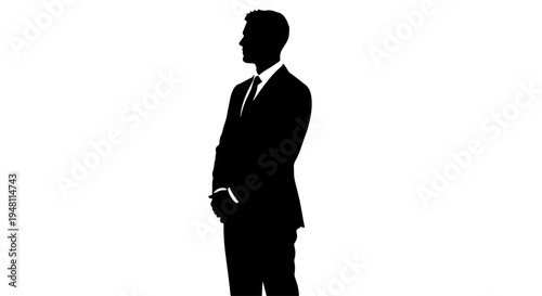 Silhouette of a man in a suit standing with his hands clasped in front of him.