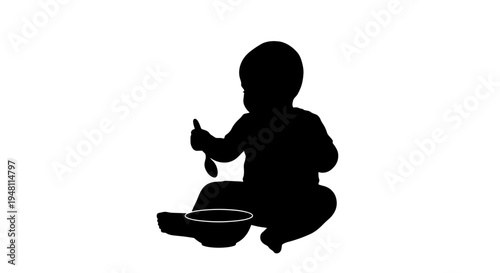 Black silhouette of a baby sitting and eating with a spoon and bowl.