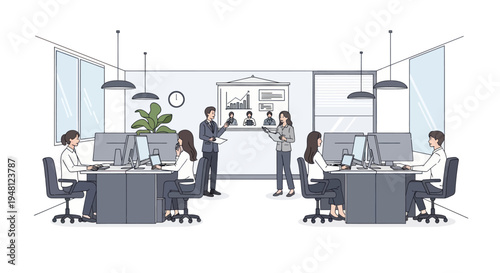 Modern office with people working at computers and discussing projects