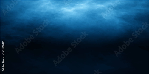 A dark blue sky with rays of light shines over a deep stormy ocean wave beneath cloudy night backgrounds