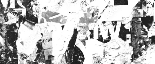 Black and white torn paper collage with fragmented text and abstract shapes