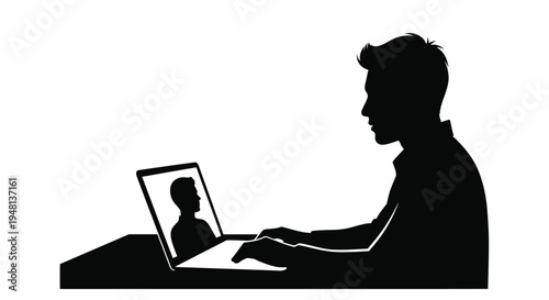 Silhouette of a man using a laptop for a video call