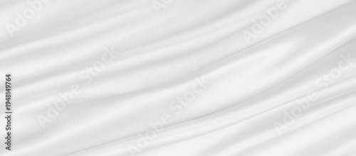 Smooth elegant white silk or satin luxury cloth texture as wedding background. Luxurious background design