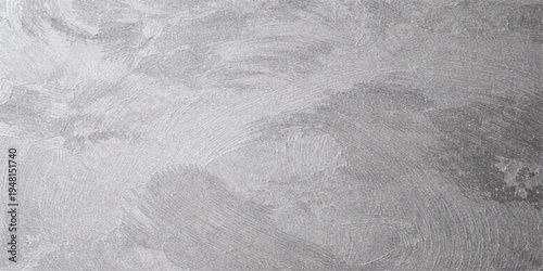 A grunge winter background featuring a rough gray stone texture with old paint and a dirty ice pattern of snow on the road and ground