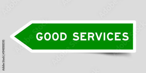 Green color arrow shape sticker label with word good services on gray background