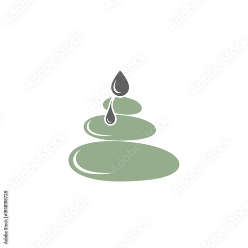 Stacked spa stones with dripping oil drop for relaxation and wellness.