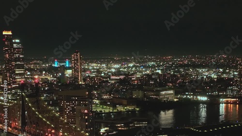 Views of New York City at night with bright city lights and skyline