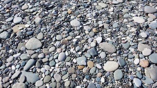 Beautiful multi-colored sea pebbles on the beach