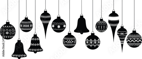 Black and white christmas ornaments hanging on strings
