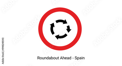 Vibrant red circular road sign indicating an approaching traffic roundabout on Spanish highways, providing essential guidance for drivers to navigate upcoming intersections safely