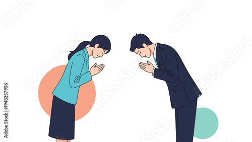 Two business professionals, a man and a woman, bowing to each other in a traditional respectful greeting or apology.
