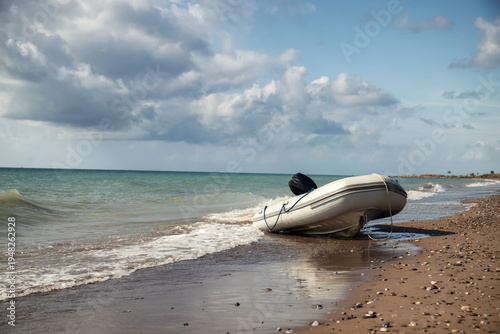 Boat on the shore under cloudy sky