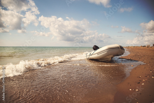 Boat on the shore under cloudy sky