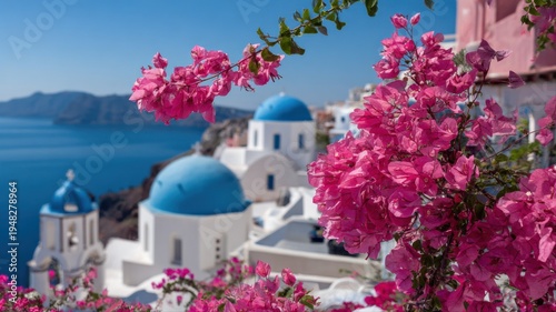 Picturesque Oia Village, Santorini: Blue Dome Churches with Pink Bougainvillea Flowers Overlooking the Aegean Sea