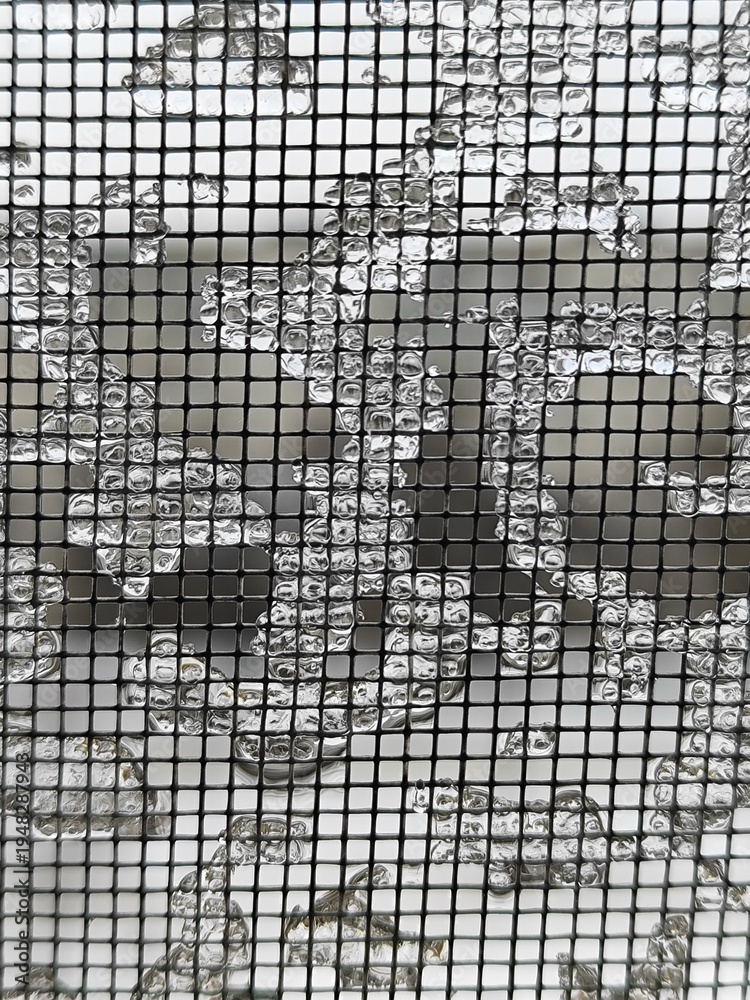 Fototapeta premium Frozen Ice Droplets on Mosquito Net Mesh Background. Winter frost and ice crystals clinging to a window screen mesh, creating a geometric abstract pattern.