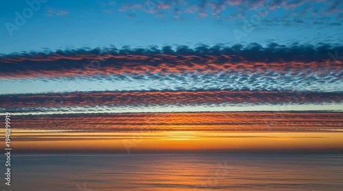 A serene ocean sunset with vibrant colors in the sky and water