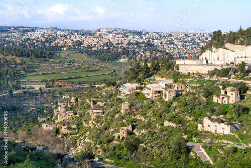 Wallpaper Mural Panoramic view of Jerusalem neighborhoods, with the abandoned village of Lifta in the foreground, located on the slope of green hills in early spring.Israel. Torontodigital.ca