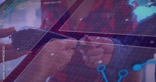 Exchanging two hands with suit cuff passing rectangular device over office table, with HUD overlay