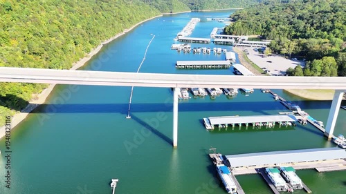 Wallpaper Mural Aerial View of the Lakeside Sunset Marina Resort on Dale Hollow Lake With Highway 111 Bridge, Boats and Forested Shoreline, Calm Water on a Sunny Day, Monroe, Tennessee, USA. Torontodigital.ca