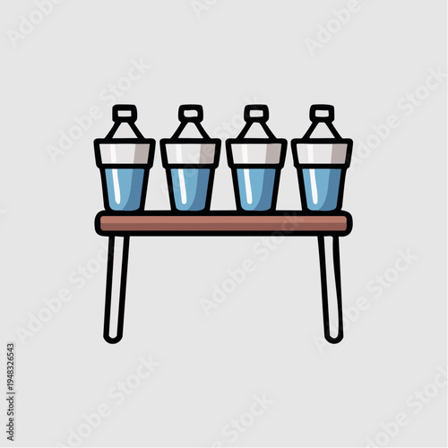 Three cocktail shakers are placed on a brown table indoors.