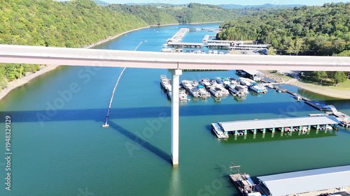 Wallpaper Mural Aerial View of the Lakeside Sunset Marina Resort on Dale Hollow Lake With Highway 111 Bridge, Boats and Forested Shoreline, Calm Water on a Sunny Day, Monroe, Tennessee, USA. Torontodigital.ca