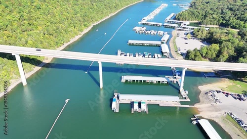 Wallpaper Mural Aerial View of the Lakeside Sunset Marina Resort on Dale Hollow Lake With Highway 111 Bridge, Boats and Forested Shoreline, Calm Water on a Sunny Day, Monroe, Tennessee, USA. Torontodigital.ca