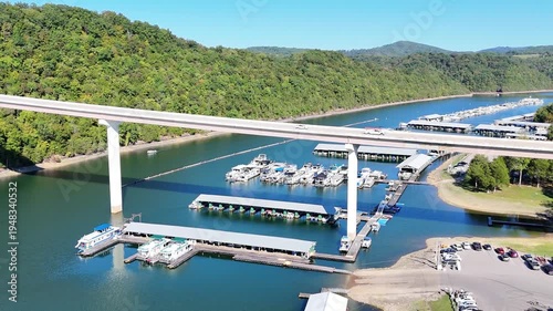 Wallpaper Mural Aerial View of the Lakeside Sunset Marina Resort on Dale Hollow Lake With Highway 111 Bridge, Boats and Forested Shoreline, Calm Water on a Sunny Day, Monroe, Tennessee, USA. Torontodigital.ca