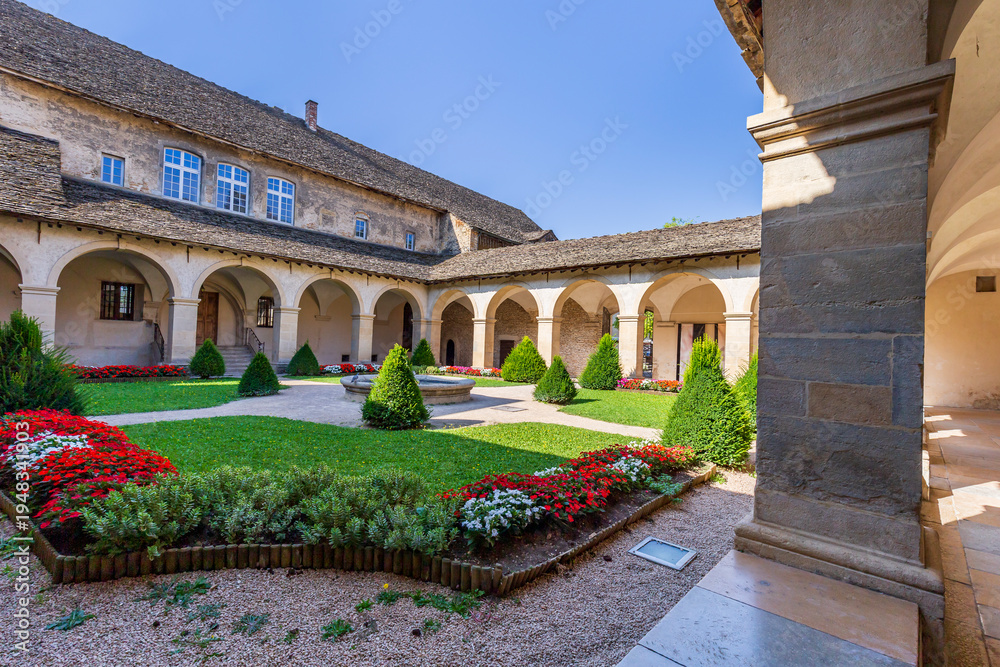 Fototapeta premium Cloister and convent of the Augustinians, Crémieu, Ain department, France. The town offers traditional architecture with its narrow medieval streets and houses since XIIe century.