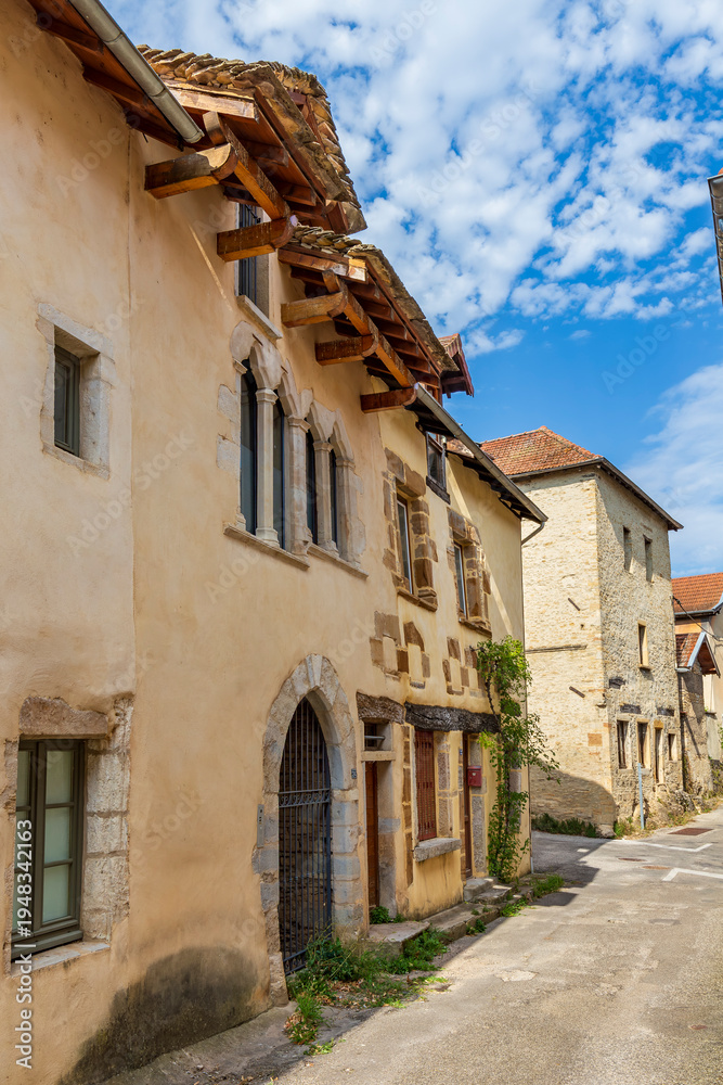 Obraz premium Medieval street Crémieu, Ain department, France. The town offers traditional architecture with its narrow medieval streets and houses since XIIe century.