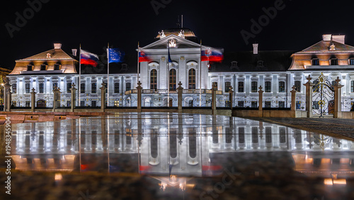 Photography Presidential Palace Bratislava at night with illuminated facade reflection
