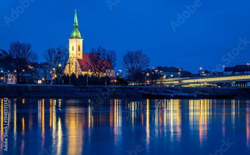 Photography Bratislava night skyline with St Martins Cathedral bridge and reflections
