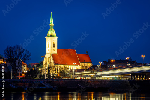Photography Bratislava night skyline with St Martins Cathedral bridge and reflections