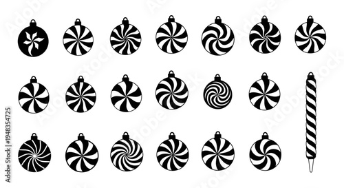Black and white peppermint candy ornaments and a candy cane on a white background festive holiday decorations