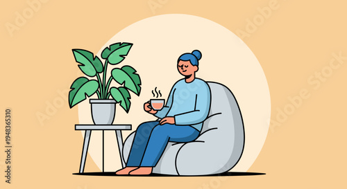 A person with a bun sits comfortably on a grey beanbag chair, holding a steaming cup, next to a potted plant on a small table, against an orange background.