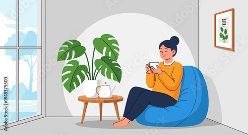 A woman relaxes on a bean bag chair, drinking tea by a window.