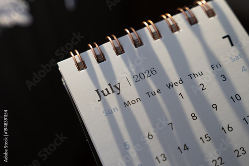 A close-up of a calendar page showing July 2026, highlighting the month and week structure, perfect for planning or organizing events.