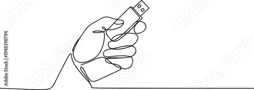 Hand gripping aUSB flash drive storage