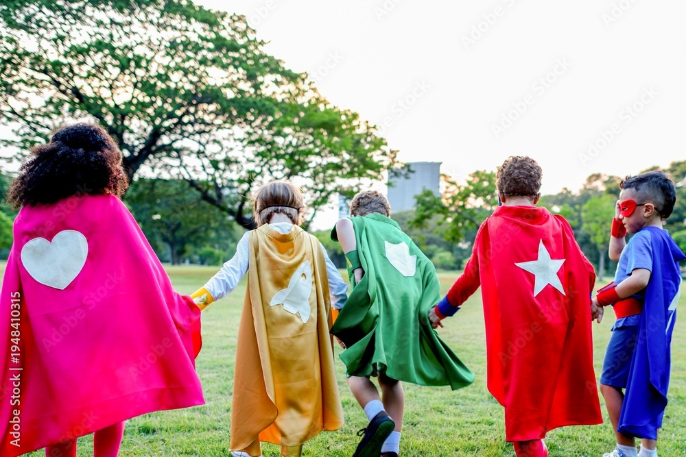 Fototapeta premium Children wearing colorful superhero capes