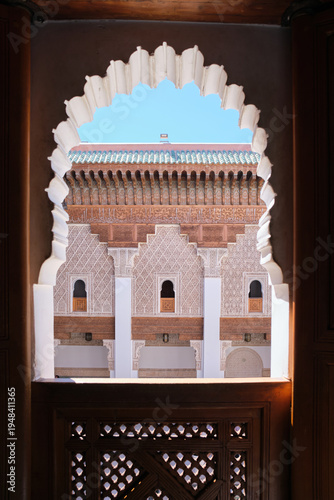 Intricate islamic architecture framing ben youssef madrasa courtyard