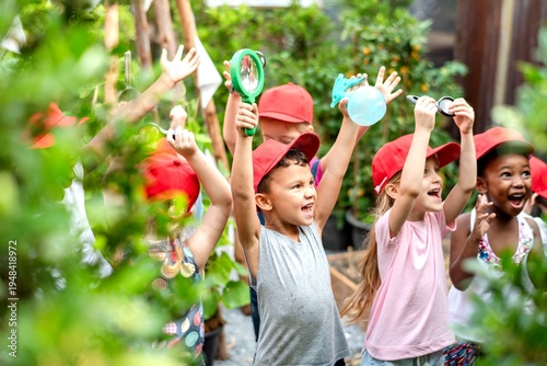Quadro su tela Joyful children exploring nature together.