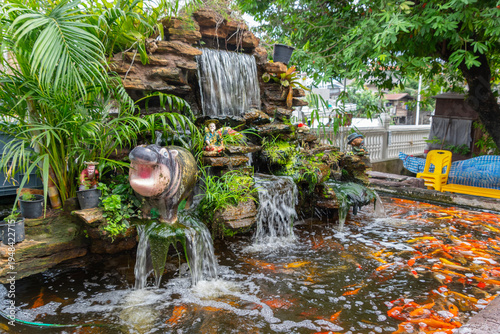 Wallpaper Mural Waterfall in a little garden on a park of Bangkok,  Thailand Torontodigital.ca